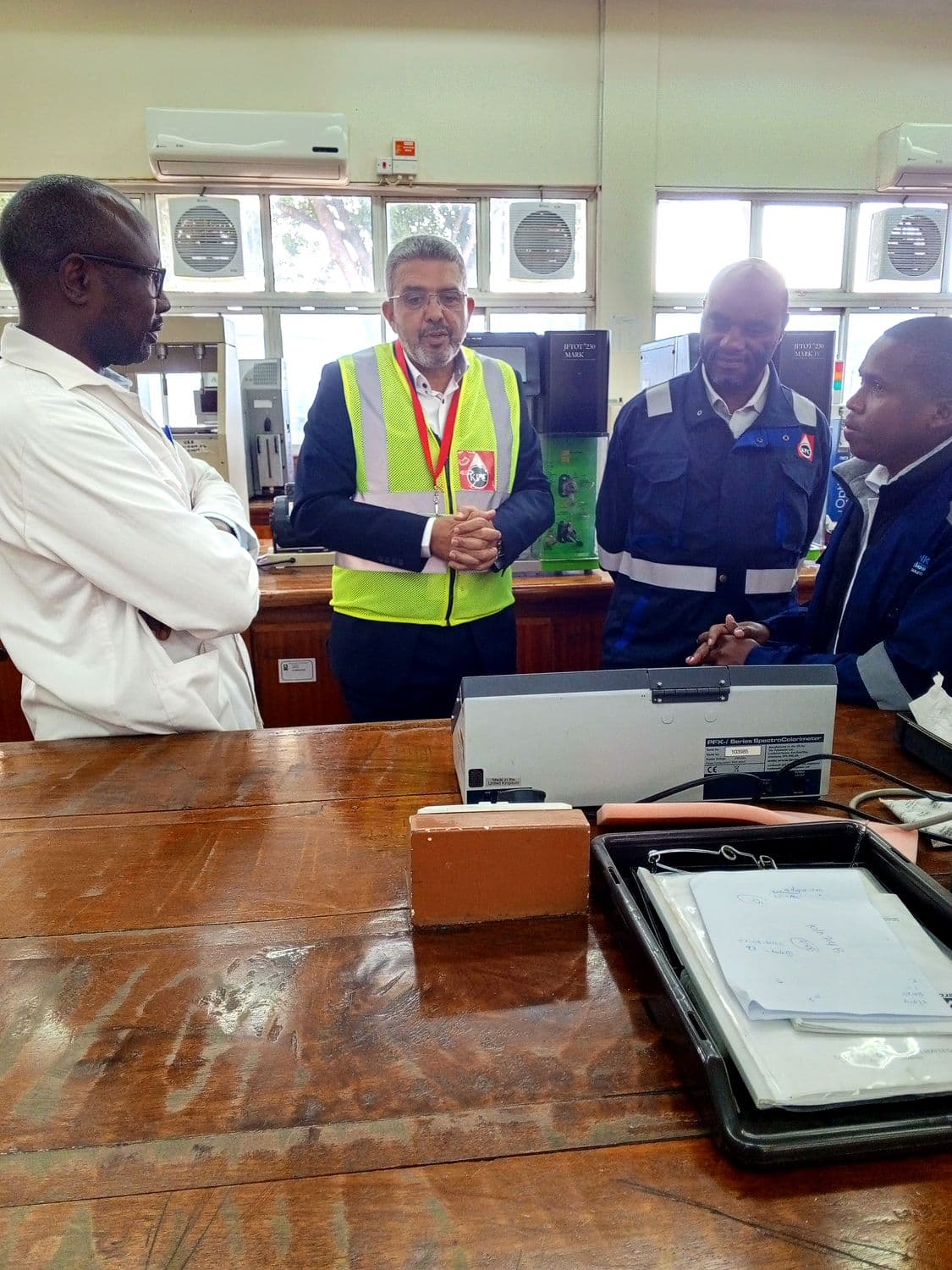 Discussing analytical methods and instrument calibration with lab staff